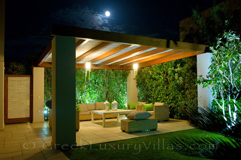 Outdoor lounge area of island style seafront villa in Almyrida Crete
