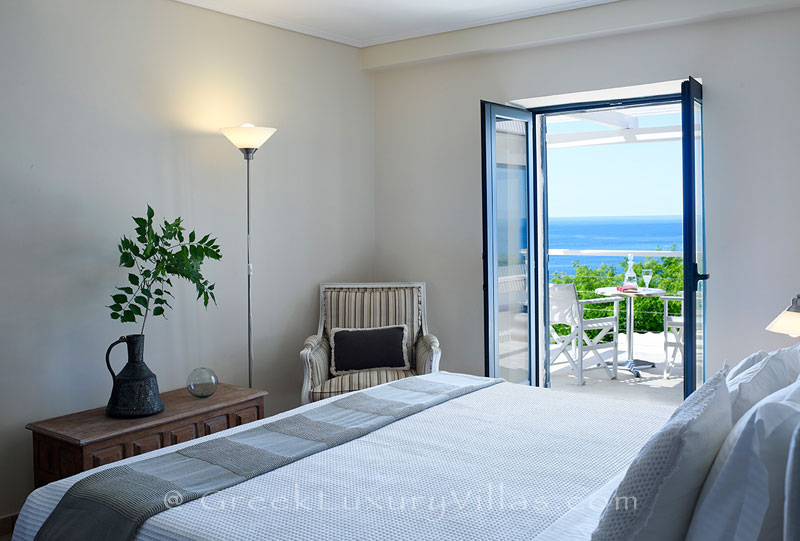 A bedroom in the luxury villa with a heated pool in Sivota