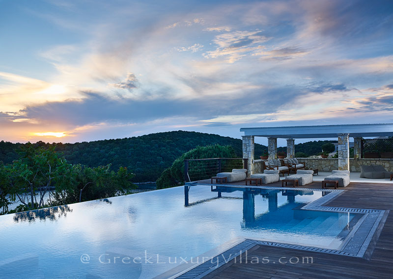 The sunset from a luxury villa with a heated pool in Sivota