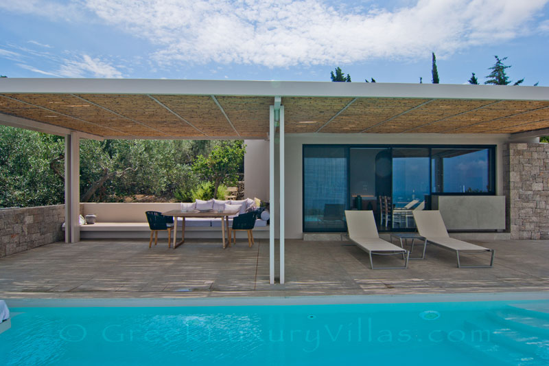 The seaview from the outdoor lounge by the pool of a modern villa in Lefkas