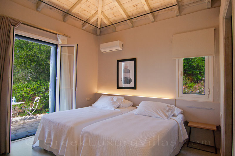 Modern villa bedroom with garden access in Lefkas