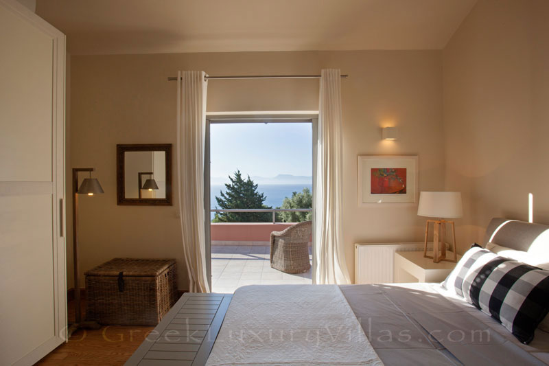 The seaview from a bedroom of a modern luxury villa with a pool in Lefkada