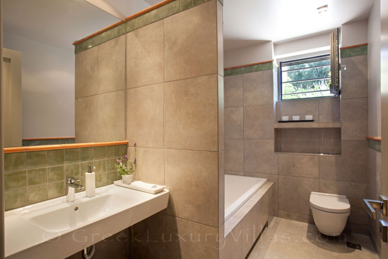 A bathroom of a modern luxury villa with a pool in Lefkas