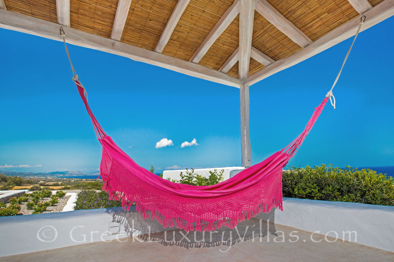 A hammock in a luxury villa with a pool in Rhodes
