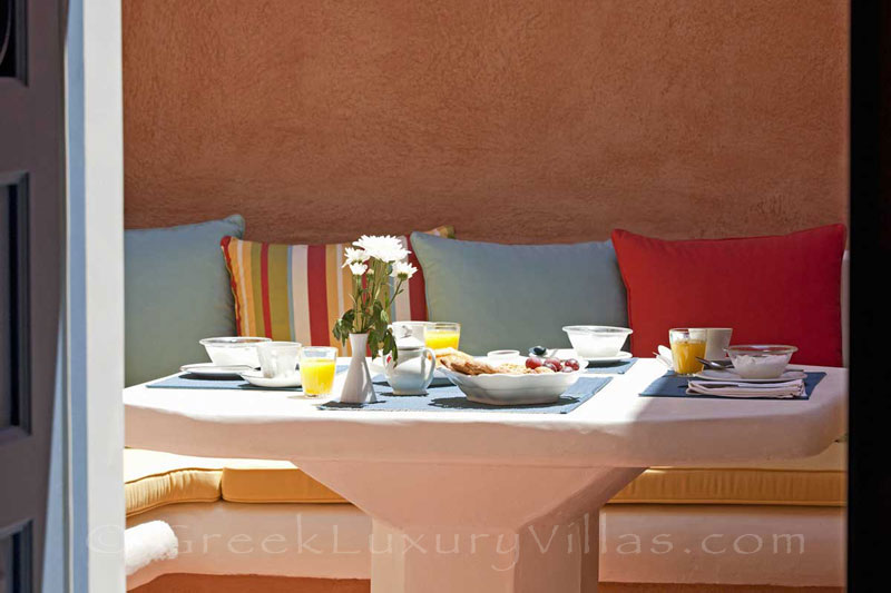 Breakfast in the courtyard of a mansion luxury villa in Oia, Santorini
