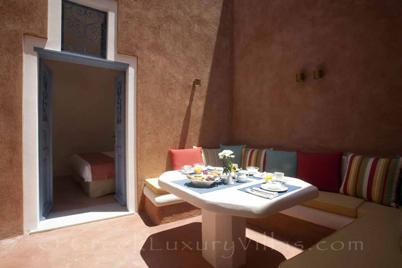 Breakfast in the courtyard of the mansion luxury villa in Oia, Santorini