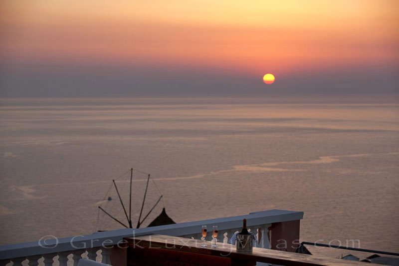 Panoramic sunset view from the roof terrace of the luxury villa in Oia, Santorini