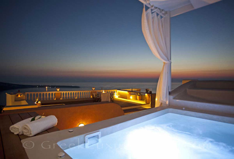 Panorama sunset from the whirlpool bath of luxury villa in Oia, Santorini