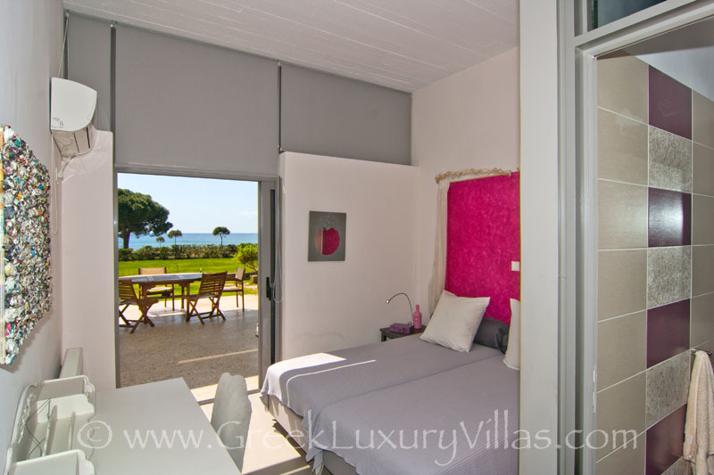 Bedroom with sea view in beach front villa near Athens