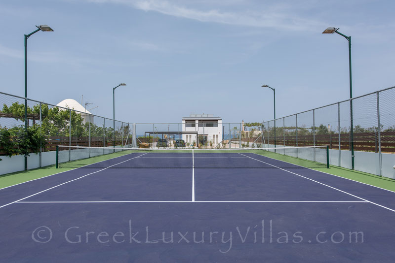 flood light private tennis court at villa with swimming pool