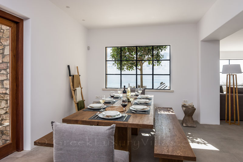 Indoor dining in an absolute beachfront luxury villa