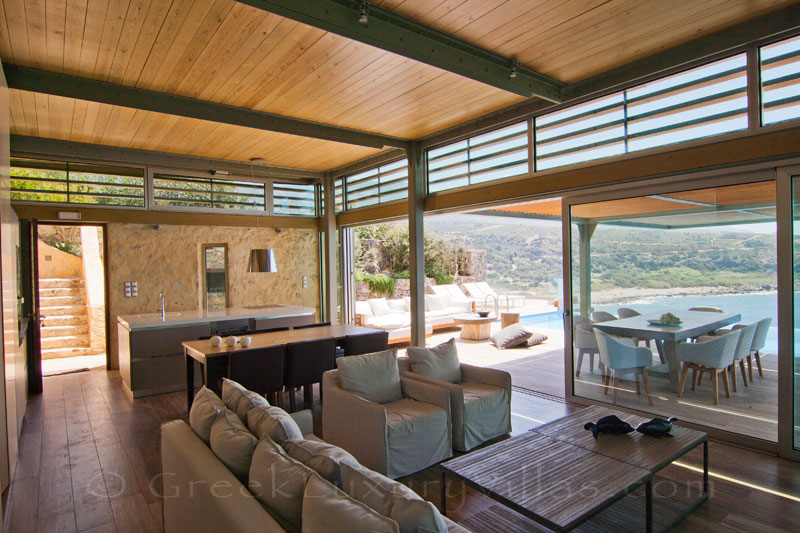 modern seafront villa with pool and open plan lounge in Crete