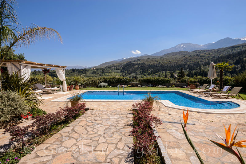 Big garden of luxury villa with pool in Crete