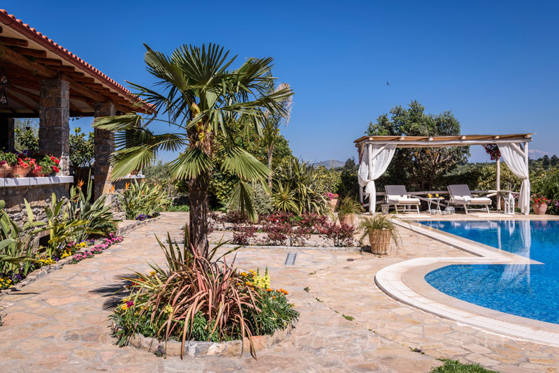 Outdoor area of luxury villa with pool in Crete