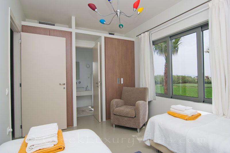 A bedroom of a beachfront villa in Maleme, Crete