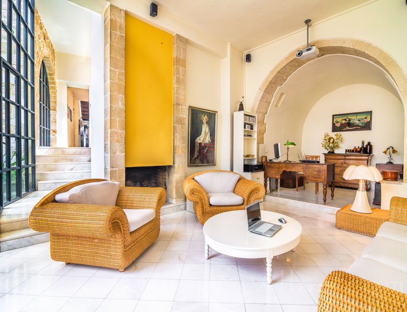 The sunny lounge of an exclusive historic villa in a traditional village of Crete