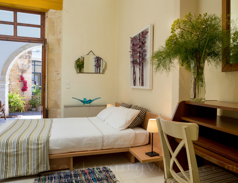 A bedroom of an exclusive historic villa in a traditional village of Crete