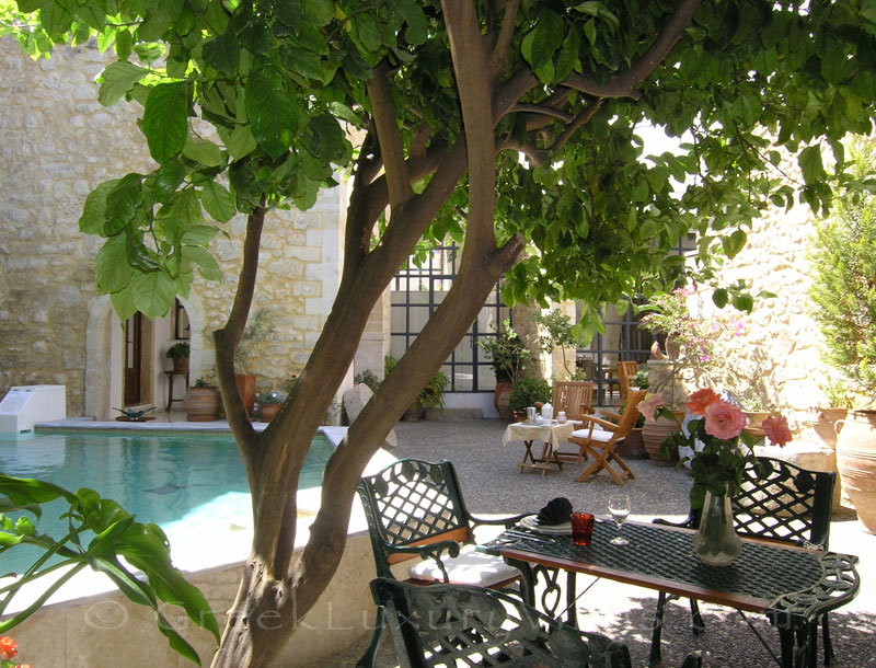 The pool yard of an exclusive historic villa in a traditional village in Crete