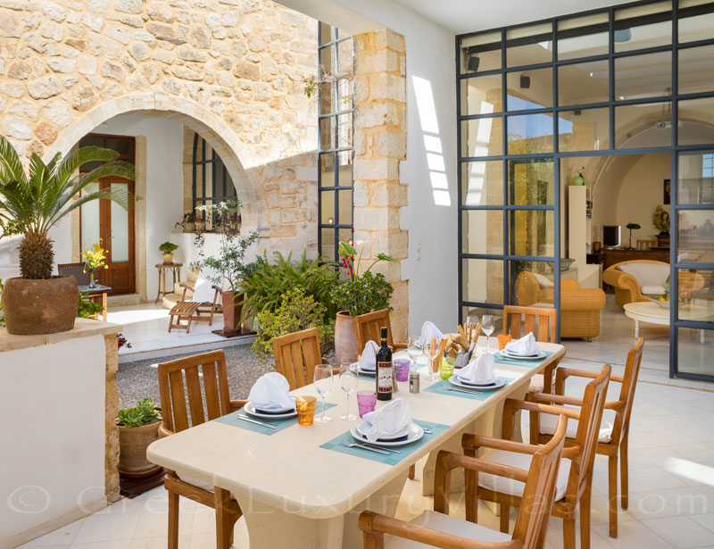 Dining al-fresco at an exclusive historic villa in a traditional village of Crete