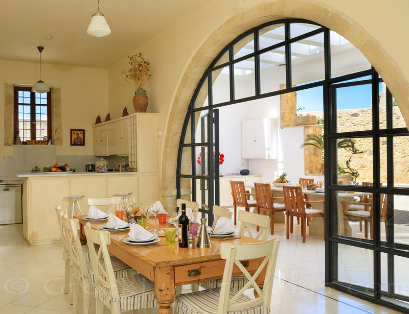 Indoor dining area of the exclusive historic villa in a traditional village of Crete