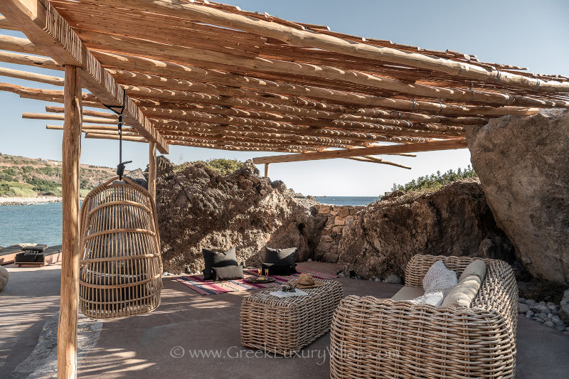 Beach house right on the beach with natural rocks and pool in Crete