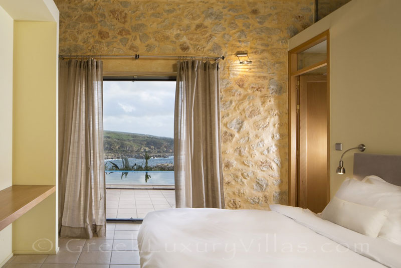 Bedroom of seafront villa with pool in Crete