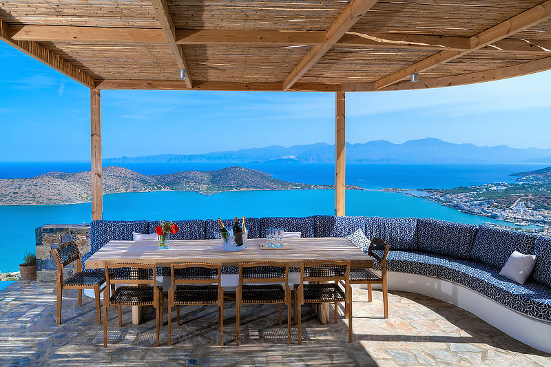 Shaded pergola dining with sea view over Elounda Bay, Crete