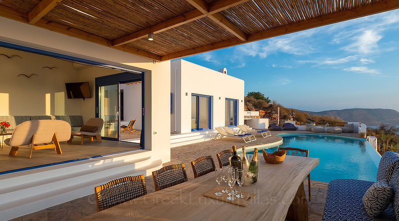 Sun-drenched open plan living room of luxury villa in Crete