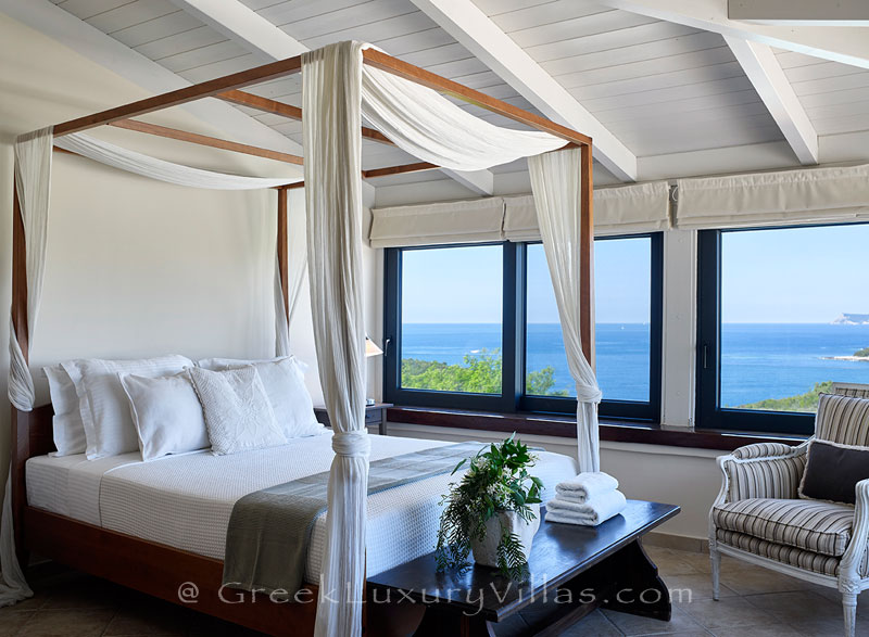 The view of the sea from the bed of a luxury villa with a heated pool in Sivota