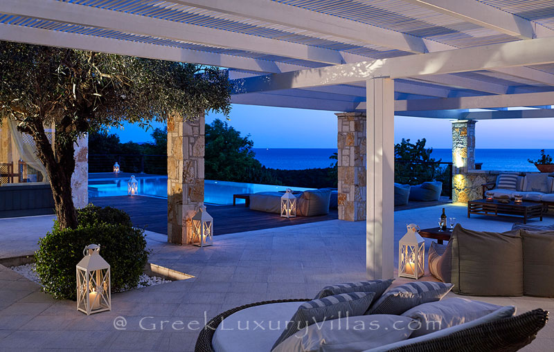 The outdoor lounge of the luxury villa with a heated pool in Sivota