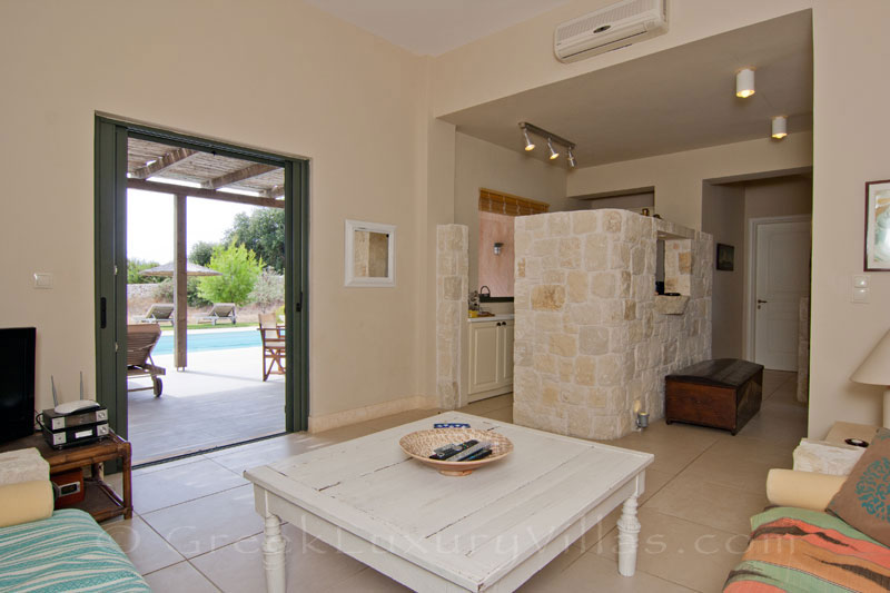 A living-room of a two bedroom modern villa with a pool in Kefalonia