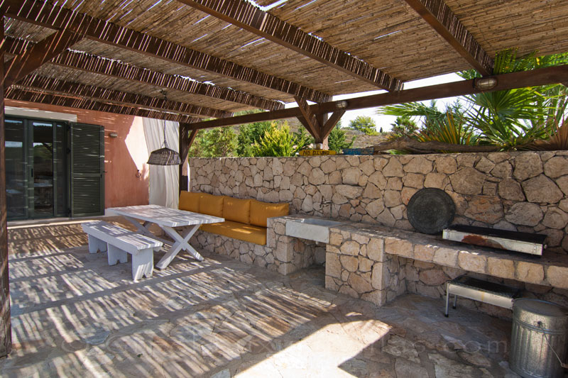 The BBQ area of a modern, three-bedroom villa with a pool in Kefalonia