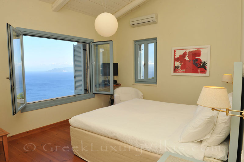 A bedroom in a luxury villa with a pool in Lefkas that sleeps six people