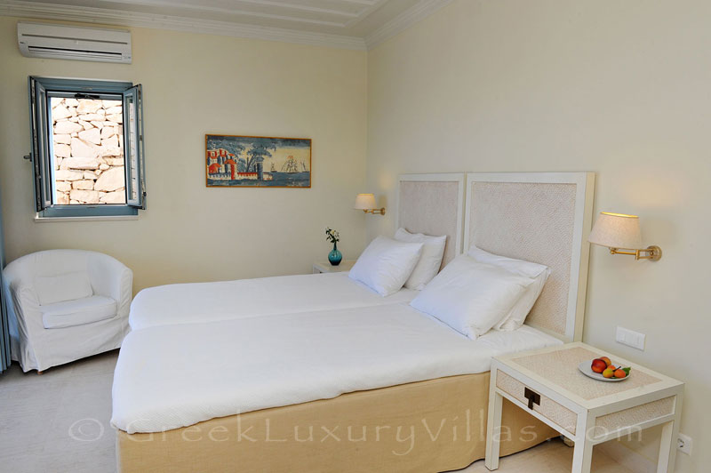 A bedroom in the luxury villa with a pool in Lefkas that sleeps six people