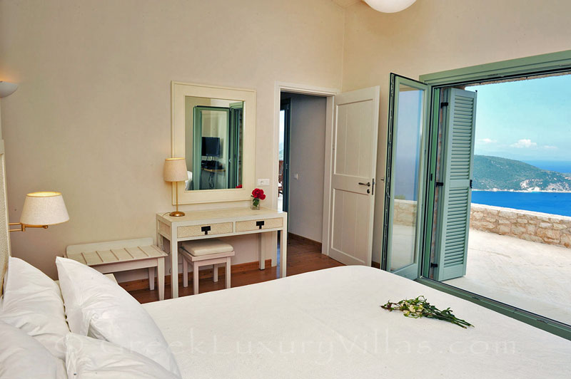 The bedroom of a luxurious villa with a pool and seaview in Lefkada