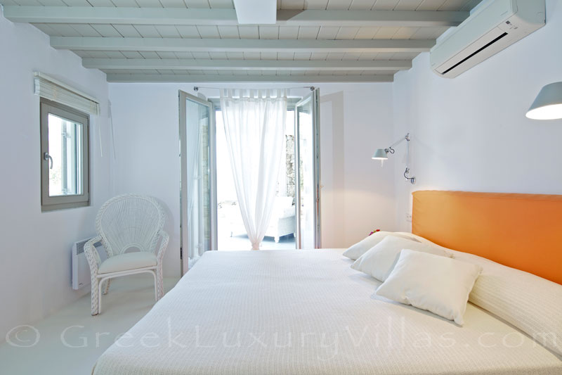 Mykonos Kalafatis-Beach luxury villa orange bedroom