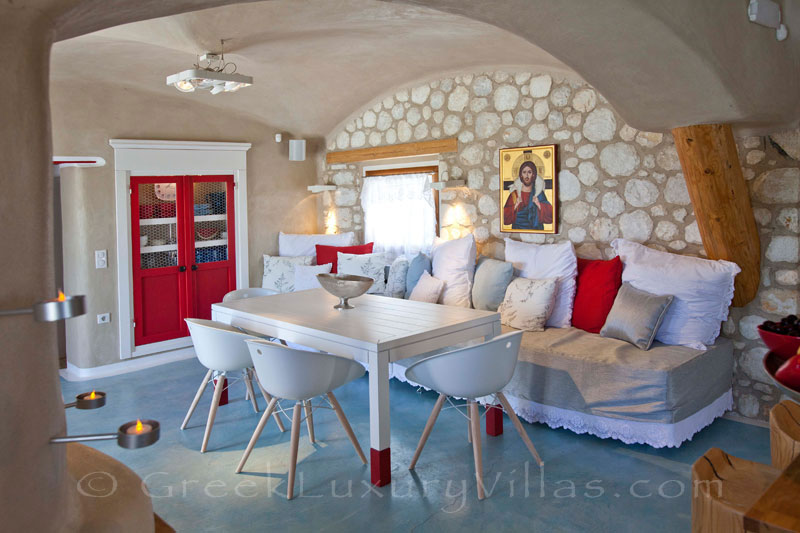 A stylish living-room of a luxury villa with a pool