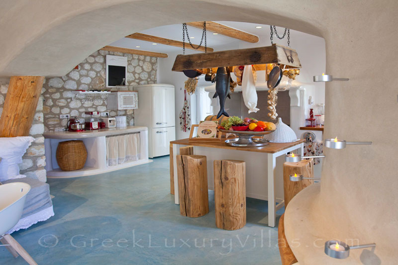 A stylish open plan kitchen of a luxury villa with a pool in Naxos