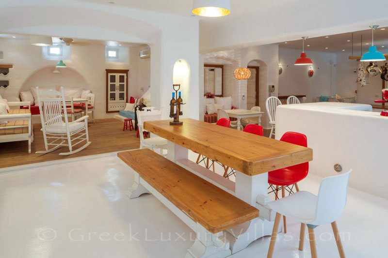 A big professional kitchen in a luxury villa with a pool