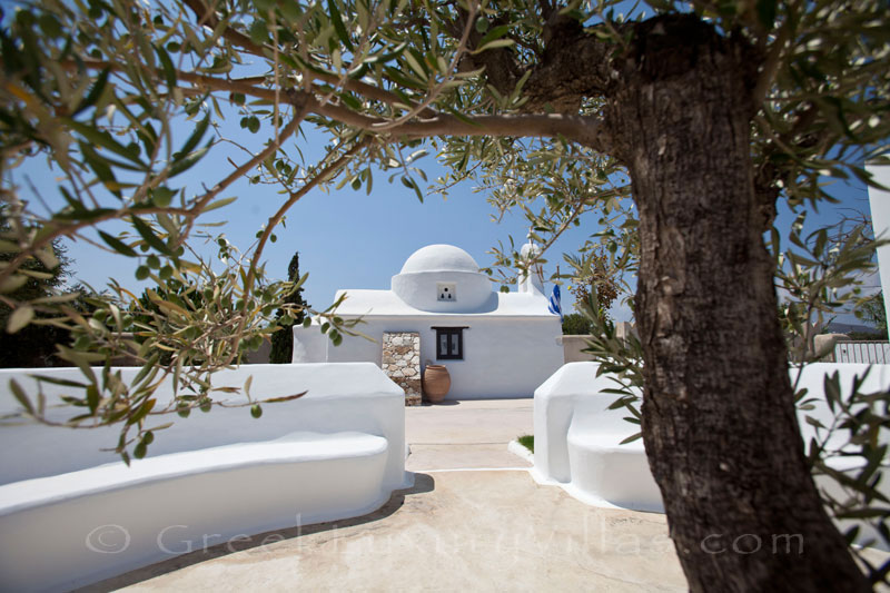 The chapel in the garden of a luxury villa with a pool in Naxos