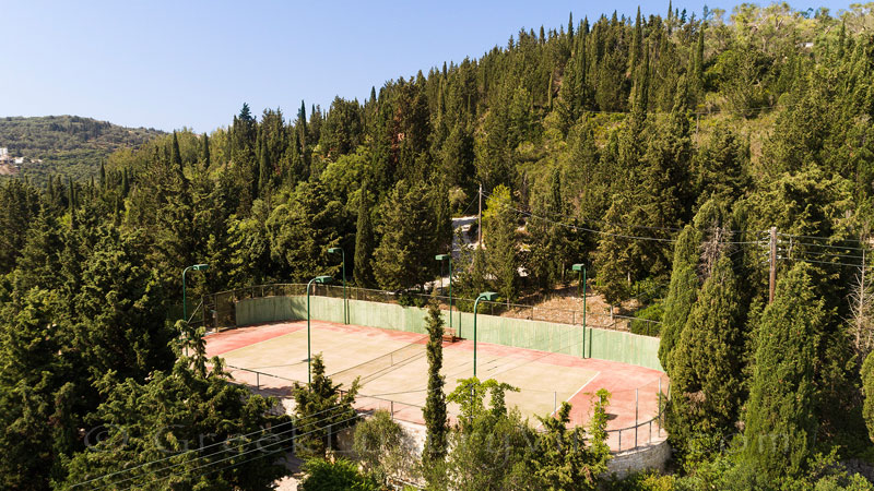 private tennis court of beachfront luxury villa