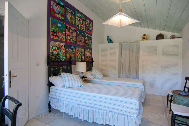 A bedroom in a beachfront villa in Paxos