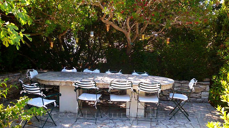 A dining table in the garden of the beachfront villa in Paxos