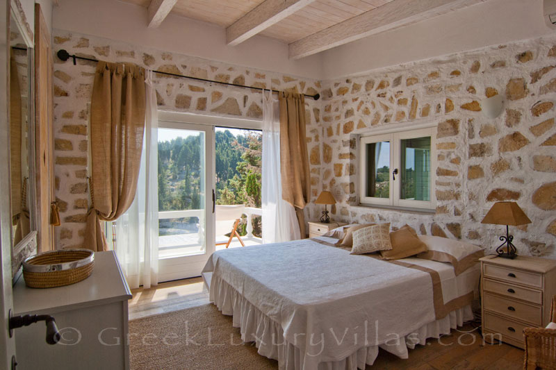 A bedroom in the seafront luxury villa in Paxos