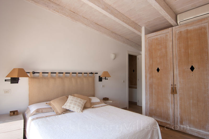 A bedroom with seaview in the luxury villa with a pool in Paxos