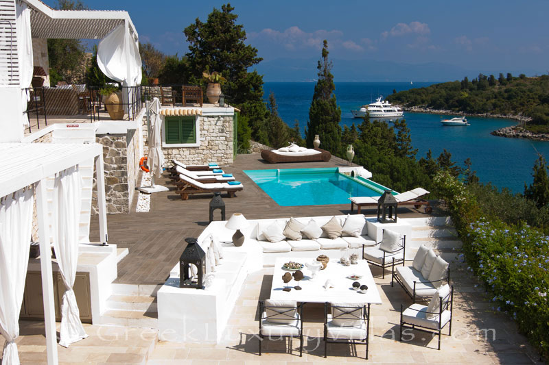 A seafront luxury villa with a boat mooring in Paxos