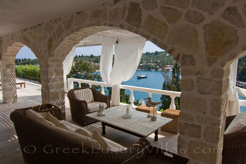 Boat mooring at a seafront luxury villa with a pool in Paxos