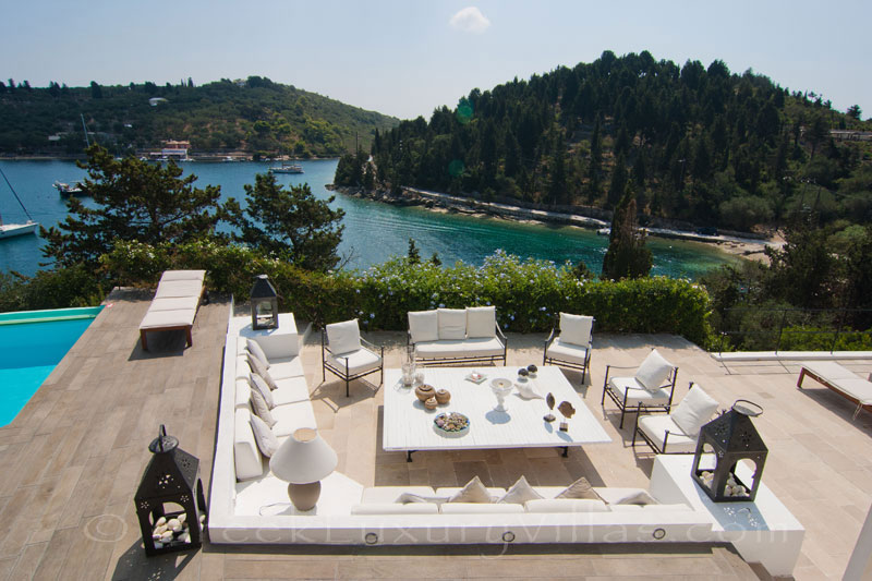 A waterfront luxury villa with a boat jetty in Paxos