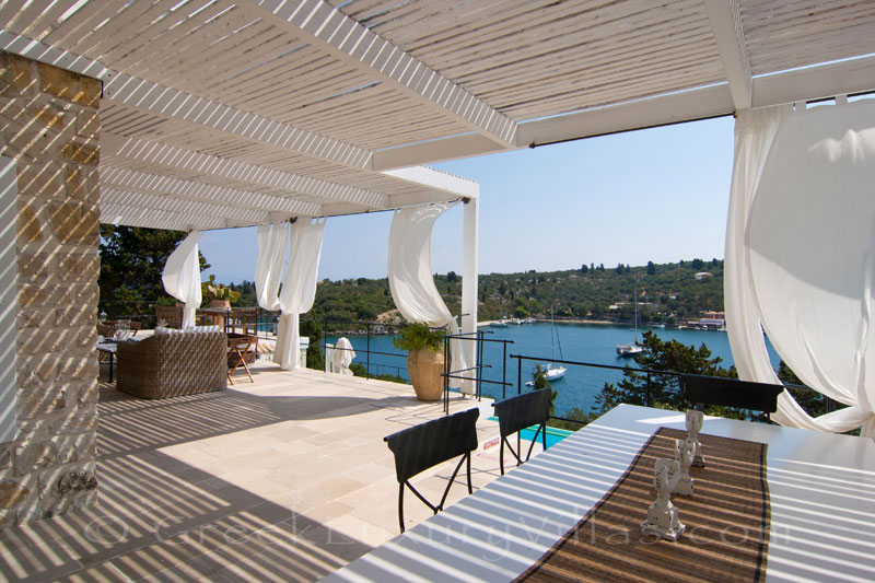 Dining area for big groups in a seafront luxury villa in Paxos