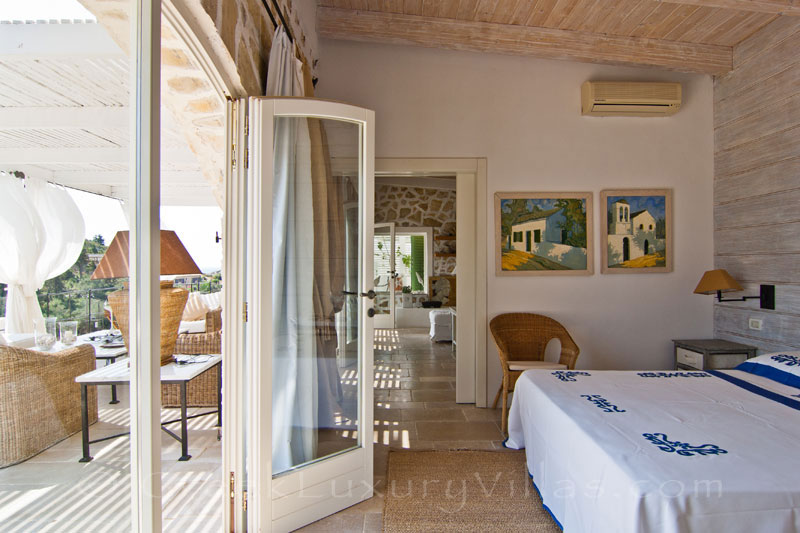 A bedroom with seaview in a seafront luxury villa in Paxos